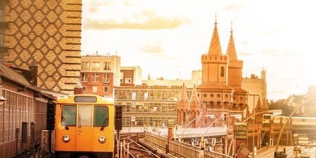 yellow berlin metro train arriving at Station Oberbaumbrücke