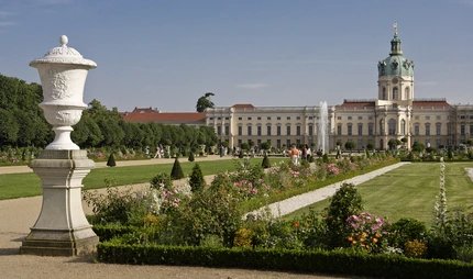 Walkers in the summery park of Charlottenburg Palace